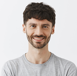 confident-handsome-guy-posing-against-white-wall